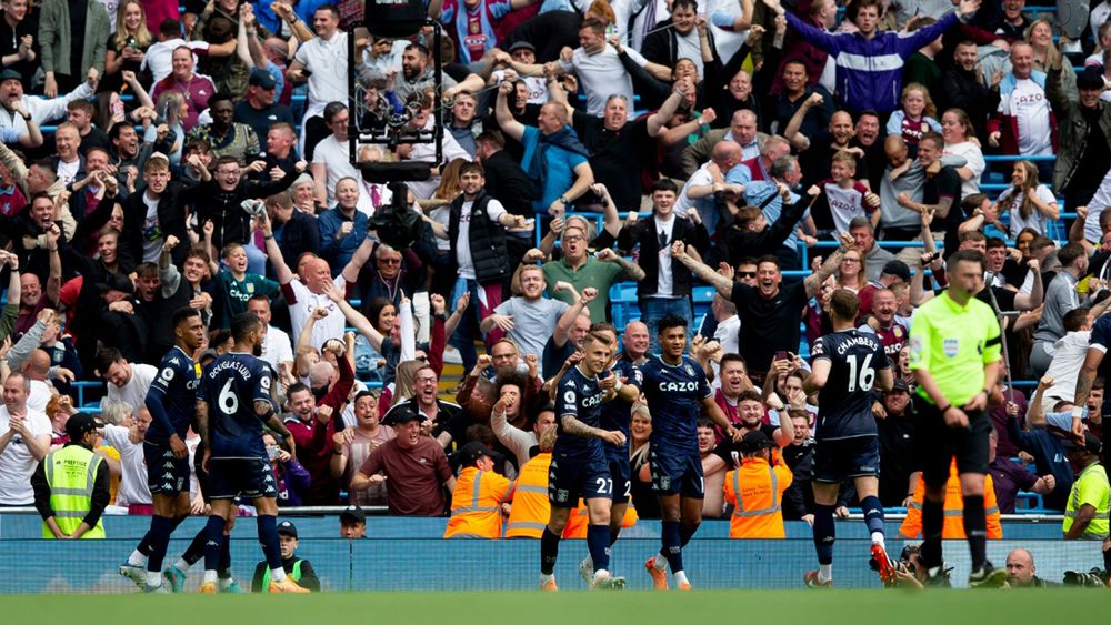 Fans celebrate the opening goal.